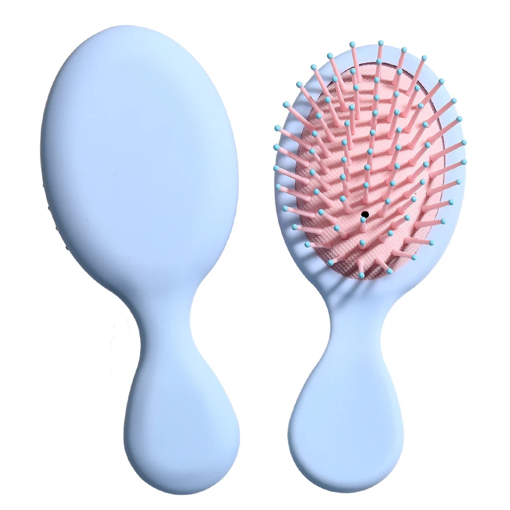 Blue Mini Detangler Hair Brush by Organic Cecret, designed for gentle detangling with minimal breakage.