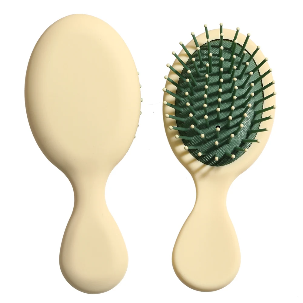Stylish orange Mini Detangler Hair Brush by Organic Cecret, suitable for kids and adults for easy hair management.