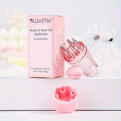 Pink scalp and hair oil applicator with packaging on a white background
