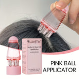 Pink ball applicator for scalp and hair oil application with packaging and hair being massaged.