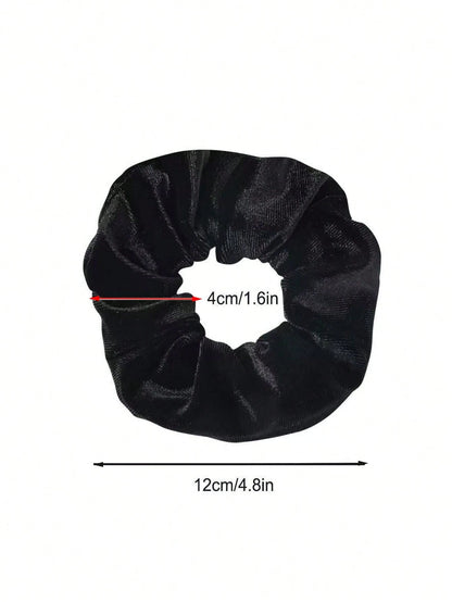 Black scrunchie with measurements on a white background